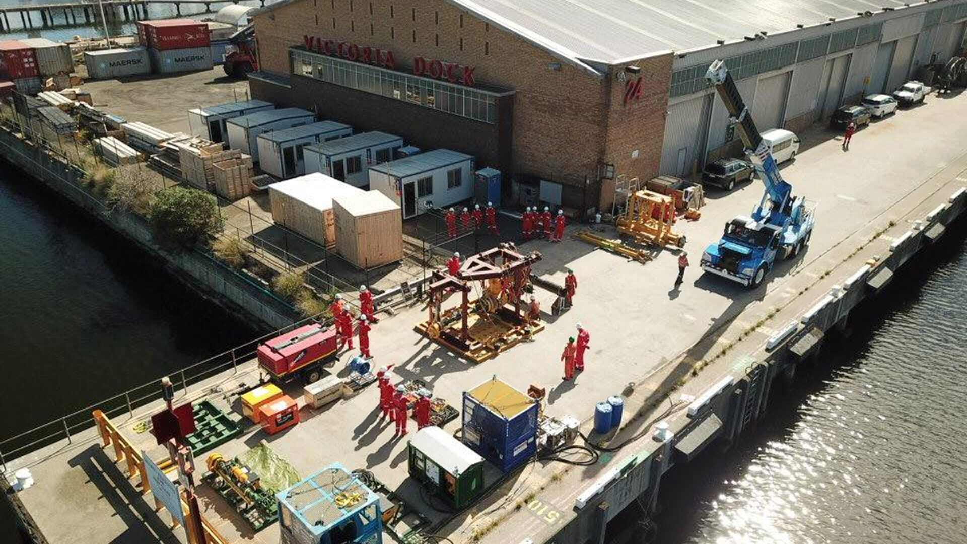 Looking down into Victoria Dock of team working with Subsea Mechanical Clamp