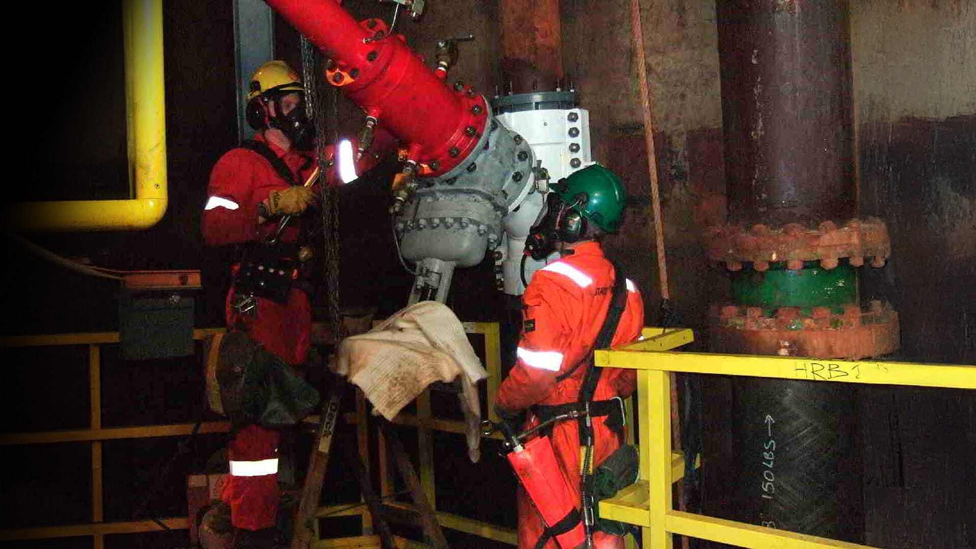 Engineers draining splitting machine on BA after cutting coupon
