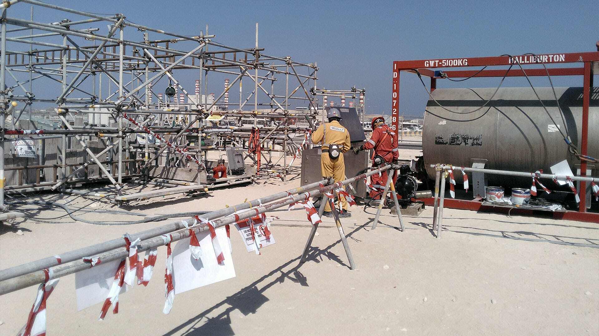 Team working on a Tecno Plug in Qatar