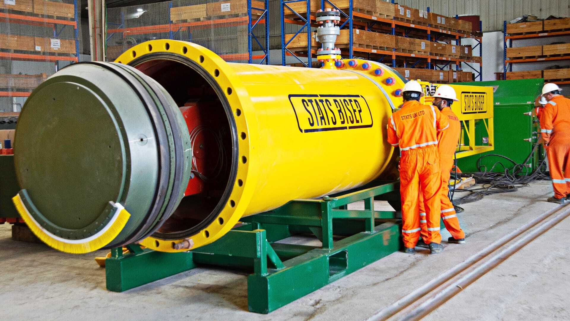 Engineers working on a BISEP tool in the workshop